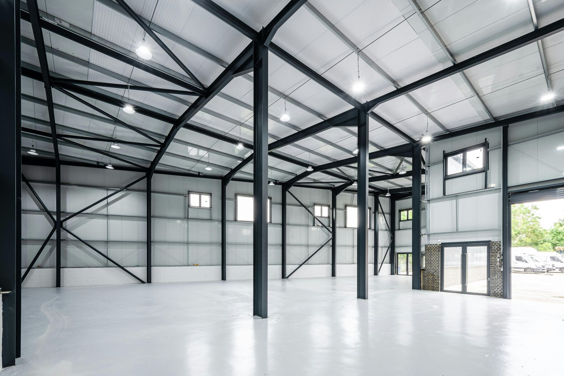 Completed steel portal frame interior with columns, rafters and bracing at Uplands Business Park